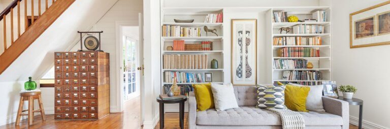 cottage-style-home-with-unique-furniture-and-a-colourful-bookshelf