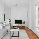 living-room-with-floorboards-shutters-and-lots-of-natural-light